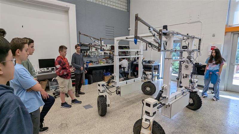 I show a student how to drive the robot.
